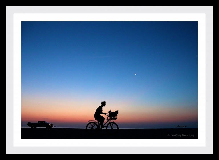 Sunrise photography - man & dog on bike